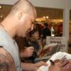 Johnny Tapia takes time to sign autographs for his fans