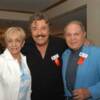 Tony Orlando hugs Maria and Carlos Ortiz