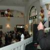 John H. Stracey entertains VIP Cocktail Party attendees with a song