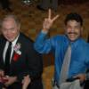 Alexis Arguello flashes the peace sign as Carlos Ortiz looks on