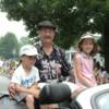 Canastota's Billy Backus enjoys the parade with his grandchildren