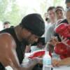 WBO heavyweight champion "Relentless" Lamon Brewster signs autographs after a public workout session