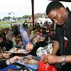 Pernell (Sweet Pea) Whitaker signs autographs for his fans