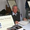 Hall of Fame referee Arthur Mercante signs copies of his book "Inside The Ropes"