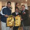 2006 Hall of Famer "Chiquita" Gonzalez donates fight-worn memorabilia to the Hall. Hall director Ed Brophy and Hall of Fame promoter Bob Arum accept the robe and trunks
