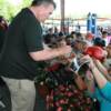 Canada's George Chuvalo signs autographs after a ringside chat
