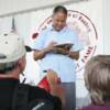 Hall of Fame light heavyweight champion Jose Torres signs autographs