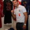 Lucian Bute poses by the display of his fight-worn boxing trunks