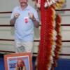 Danny "Little Red" Lopez poses by his famous headdress that we wore throughout his career and on the cover of Sports Illustrated