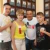 The Tszyu family gathers by the Hall of Fame Wall.