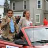 Hall of Famer "Chiquita" Gonzalez and his wife Margarita wave to fans during the Parade of Champions.