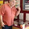 George Chuvalo proudly poses by his display