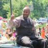 "Double M" Michael Moorer waves to fans during the parade
