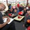 Hall of Famer Michael Spinks signs autographs for his fans