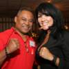 Juan LaPorte and Mia St. John put their fists up for a photo