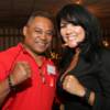 Juan LaPorte and Mia St. John put their fists up for a photo