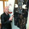 Angel Manfredy points to his fight worn robe on display in the Hall of Fame