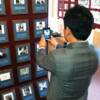 2013 Inductee Myung-Woo Yuh takes a photo of his plaque on the Hall of Fame Wall