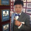 The second Korean inducted into the Hall of Fame, Myung-Woo Yuh poses by his Hall of Fame plaque