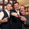 Enzo Calzaghe (right) and Joe Calzaghe Jr (left) proudly point to Joe Sr.'s Hall of Fame ring.