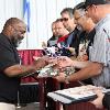Two-division champion and Hall of Famer Dwight Qawi signs autographs