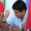 Erik "El Terrible" Morales signs autographs for his many fans