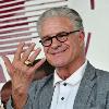 HBO broadcaster Jim Lampley shows fans his gold Hall of Fame ring.