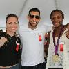 Heather "The Heat" Hardy, Amir Khan and Claressa Shields pose for a photo.