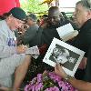 "Irish" Micky Ward signs autographs for fans. 