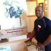 Tracy Harris Patterson poses by his father's Hall of Fame exhibit. 