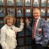 Jimmy Lennon Jr. and his mother Doris point tothe Lennon's plaques on the Hall of Fame Wall. 