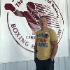 "Irish" Micky Ward poses by the Hall of Fame logo.