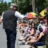 Gerry Cooney high fives fans along parade route.