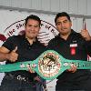 Three-time ring rivals and Hall of Famers Marco Antonio Barrera and Erik Morales pose with the WBC championship belt