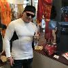5-time champion Vinny Paz poses by his boxing robe on display in the HOF