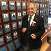 Hall of Fame welterweight champion Tony DeMarco in fighting pose by his plaque on the HOF Wall