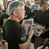 Hall of Famer Teddy Atlas obliges autograph requests from fans on the HOF grounds