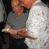 Angelo Dundee signs an autograph for a boxing fan