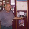 DiVeronica, who played an integral part in Canastota's 100 plus year boxing history, stands proudly by the "Why Canastota" exhibit in the HOF Museum