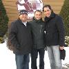 (left to right) Manager Daniel Zamora, Petrov and matchmaker Alex Camponovo stop for a photo by the HOF logo