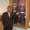 Gatti points to his trainer Buddy McGirt's robe on display in the Hall