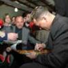 Gatti signs autographs for his fans