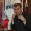 Gatti poses by his robe on display in the Hall of Fame