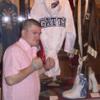 Hatton puts his fists up by Arturo Gatti's display