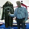 2015 Hall of Famer Jim Lampley poses with fellow inductee "Prince" Naseem Hamed’s robe
