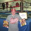 Fight photographer Ed Mulholland proudly dislpays both his first Ring cover and first ever cover (Boxing Digest) that are in the Hall's research library