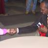 A young fan shakes hands with Hearns after getting his autograph