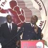 Hearns address the crowd as his son, Ronald, looks on
