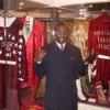 Hearns poses by robes worn by Sugar Ray Leonard and Marvelous Marvin Hagler