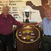 BBBC chairman Charles Giles and HBO's Harold Lederman pose by Tony Zale belt exhibit